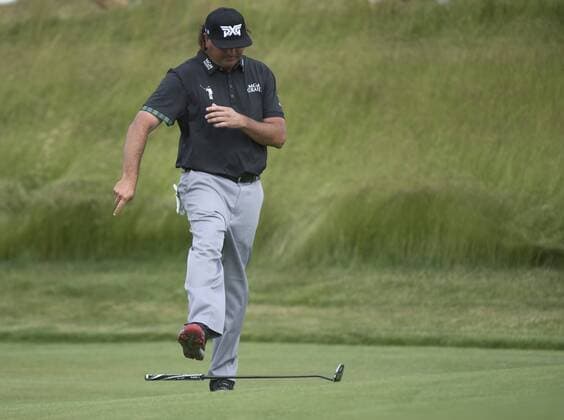 Pat Perez kicks his putter after missing a shot on the 17th green during round 2 of the 117th U.S. Open golf tournament at Erin Hill golf course in Erin, Wisconsin on June 16, 2017.  WIS20170616301 KEVINxDIETSCH