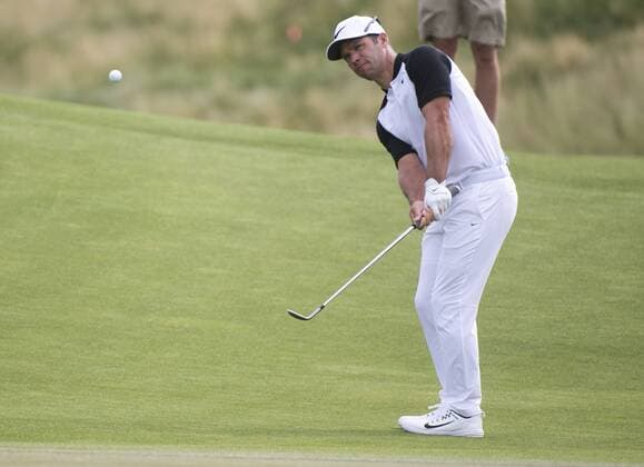Paul Casey chips on the 12th hole during round 2 of the 117th U.S. Open golf tournament at Erin Hill golf course in Erin, Wisconsin on June 16, 2017.  WIS20170616310 KEVINxDIETSCH