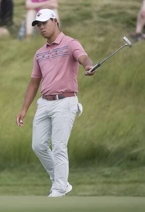Si Woo Kim celebrates after putting for birdie on the 17th green during round 2 of the 117th U.S. Open golf tournament at Erin Hill golf course in Erin, Wisconsin on June 16, 2017.  WIS20170616313 KEVINxDIETSCH