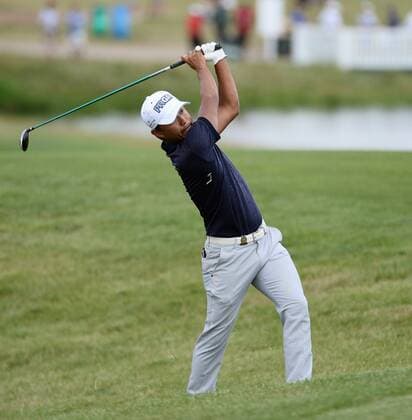 Satoshi Kodaria makes his approach shot on the 10th hole during round 3 of the 117th U.S. Open golf tournament at Erin Hill golf course on June 17, 2017 in Erin, Wisconsin.  BK18269 BRIANxKERSEY