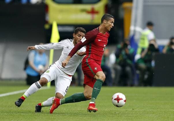 Portugal vs. Mexico KAZAN, RT - 18.06.2017: PORTUGAL VS. MEXICO - CRISTIANO RONALDO of Portugal fights with DOS SANTOS Jonathan of Mexico during a match between Portugal and Mexico valid for the first round of the Confederations Cup 2017 on Sunday (18) held at the Kazan Arena in Kazan, Russia. (Photo: Rodolfo Buhrer La Imagem Fotoarena) x1339233x  RodolfoxBuhrer
