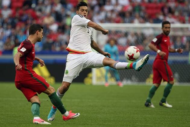 KAZAN, RUSSIA - JUNE 18, 2017: Mexico s Raul Jimenez (9), centre, kicks the ball in their 2017 FIFA Confederations Cup First Stage Group A football match against Portugal at Kazan Arena Stadium; the match ended in a 2-2 draw. Yegor Aleyev TASS  TS05388B