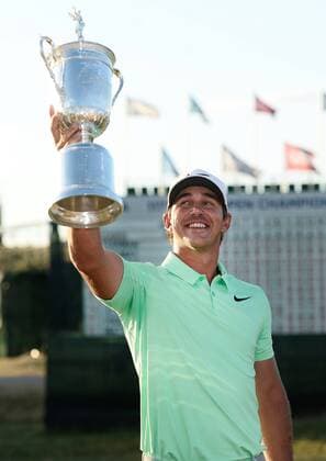 Brooks Koepka poses with the U.S. Open Trophy after the final round of the 117th U.S. Open golf tournament at Erin Hills golf course on June 18, 2017 in Erin, Wisconsin. Koepka shot a 16-under 272 to win the tournament by 4 strokes.  WIS20170618102 BRIANxKERSEY