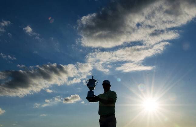 Brooks Koepka poses with the trophy after winning the 117th U.S. Open golf tournament at Erin Hills golf course on June 18, 2017, in Erin, Wisconsin. Koepka posted a final score of 16-under-par.  WIS20170618311 KEVINxDIETSCH