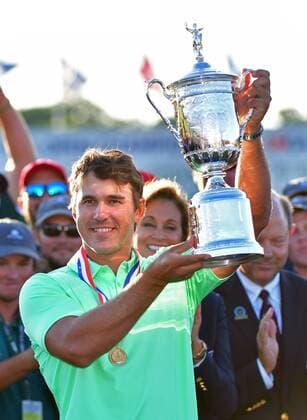 Brooks Koepka holds the trophy after his victory in the 117th U.S. Open golf tournament at Erin Hill golf course on June 18, 2017, in Erin, Wisconsin. Koepka posted a final score of 16-under-par.  WIS20170618583 KEVINxDIETSCH
