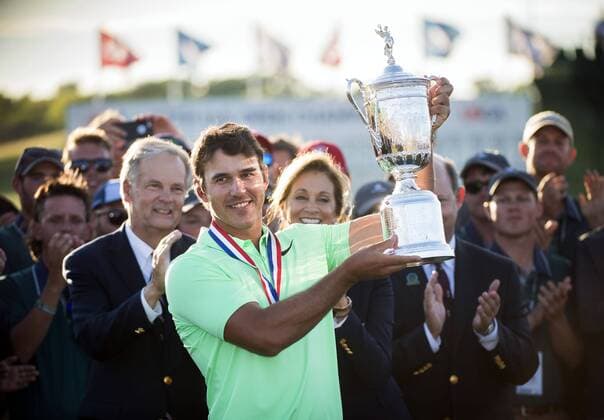 Brooks Koepka celebrates with the trophy after winning the 117th U.S. Open golf tournament at Erin Hills golf course on June 18, 2017, in Erin, Wisconsin. Koepka posted a final score of 16-under-par.  WIS20170618303 KEVINxDIETSCH