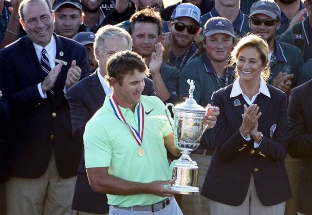 Brooks Koepka admires the trophy after his victory in the 117th U.S. Open golf tournament at Erin Hills golf course on June 18, 2017, in Erin, Wisconsin. Koepka posted a final score of 16-under-par.  WIS20170618580 BRIANxKERSEY