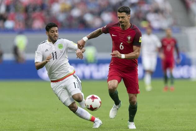 (170619) -- KAZAN, June 19, 2017 -- Portugal s Jose Fonte vies with Mexico s Carlos Vela during the 2017 Confederations Cup Group A football match in Kazan, Russia, on June 18, 2017. ) (SP)RUSSIA-KAZAN-2017 FIFA CONFEDERATIONS CUP BaixXueqi 