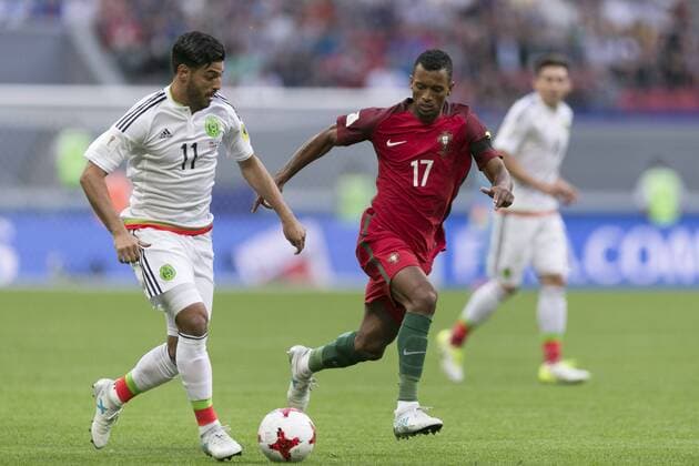 (170619) -- KAZAN, June 19, 2017 -- Portugal s Nani (front R) vies with Mexico s Carlos Vela during the 2017 Confederations Cup Group A football match in Kazan, Russia, on June 18, 2017. ) (SP)RUSSIA-KAZAN-2017 FIFA CONFEDERATIONS CUP BaixXueqi 