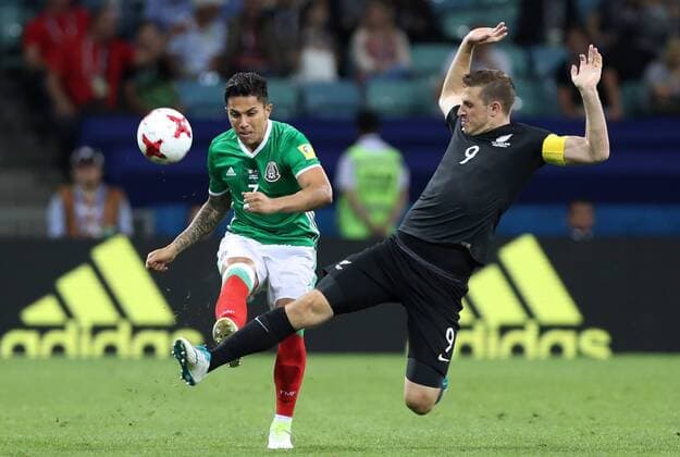 SOCHI, RUSSIA â€“ JUNE 21, 2017: Mexico s Carlos Salcedo (L) and New Zealand s Chris Wood fight for the ball in their 2017 FIFA Confederations Cup Group A match at Fisht Stadium. Artyom Korotayev TASS  TS05414A