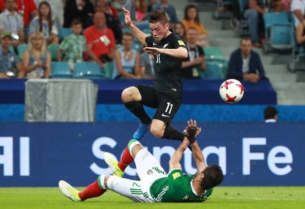 SOCHI, RUSSIA â€“ JUNE 21, 2017: New Zealand s Marco Rojas (black) and Mexico s Nestor Araujo fight for the ball in their 2017 FIFA Confederations Cup Group A match at Fisht Stadium. Sergei Fadeichev TASS  TS0541A8