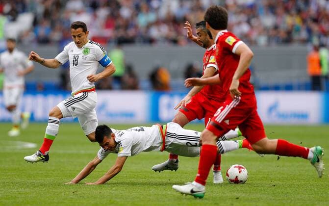 Mexico vs. Russia SAO PETERSBURGO, MO - 24.06.2017: MEXICO VS. RUSSIA - ARAUJO Nestor of Mexico dispute ball with SAMEDOV Alexander of Russia during match between Mexico and Russia valid for the third round of the Confederations Cup 2017 on Saturday (24) held Arena Kazan in Kazan, Russia. (Photo: Marcelo Machado de Melo Fotoarena) x1343475x  MarceloxMachadoxdexMelo