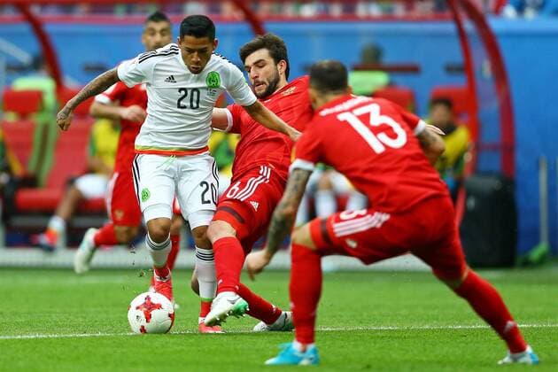 Mexico vs. Russia SAO PETERSBURGO, MO - 24.06.2017: MEXICO VS. RUSSIA - Mexico& 39;s Javier Aquino is bidding with Dzhikya Georgy of Russia during a match bet Mexico and Russia valid for the third roundound of the 2017 Confederations Cup on Saturday (24) held at the Kazan Arena in Kazan, Russia. (Photo: Heuler Andrey DiaEsportivo Fotoarena) x1343550x  HeulerxAndrey