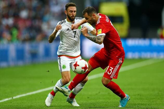 Mexico vs. Russia SAO PETERSBURGO, MO - 24.06.2017: MEXICO VS. RUSSIA - Miguel Layun of Mexico contests bid with Kudriashov Fedor of Russia during a match between Mexico and Russia valid for the third round of the Confederations Cup 2017, on Saturday (24), held at the Kazan Arena in Kazan, Russia. (Photo: Heuler Andrey DiaEsportivo Fotoarena) x1343580x  HeulerxAndrey