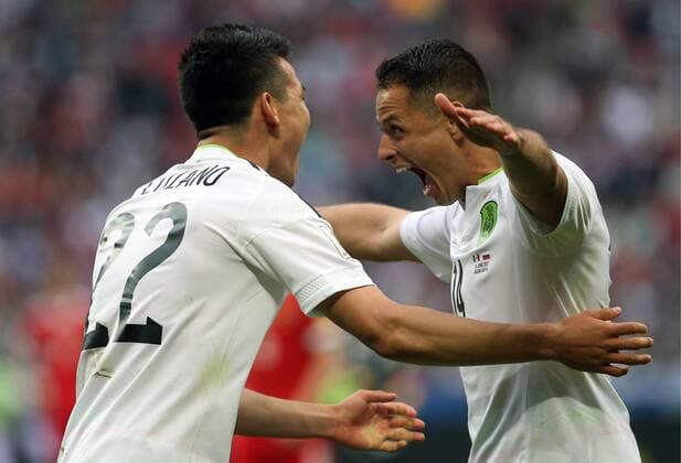 KAZAN, RUSSIA - JUNE 24, 2017: Mexico s Hirving Lozano (22) and Javier Hernandez celebrate their victory over Russia in their 2017 FIFA Confederations Cup First Stage Group A football match at Kazan Arena Stadium; Mexico won the game 2-1. Yegor Aleyev TASS  TS054A04