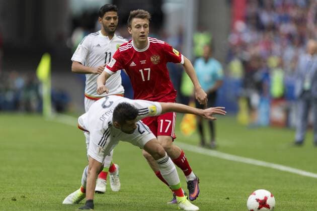 (170625) -- KAZAN, June 25, 2017 -- Nestor Araujo (Front) of Mexico vies with Aleksandr Golovin(R) of Russia during group A match between Russia and Mexico at the 2017 FIFA Confederations Cup in Kazan, Russia, on June 24, 2017. Mexico won 2-1. ) (SP)RUSSIA-KAZAN-FIFA-CONFED CUP-RUS VS MEX BaixXueqi 