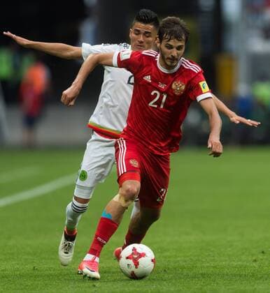 (170625) -- KAZAN, June 25, 2017 -- Aleksander Erokhin (Front) of Russia controls the ball during group A match between Russia and Mexico at the 2017 FIFA Confederations Cup in Kazan, Russia, on June 24, 2017. Mexico won 2-1. ) (SP)RUSSIA-KAZAN-FIFA-CONFED CUP-RUS VS MEX EvgenyxSinitsyn 