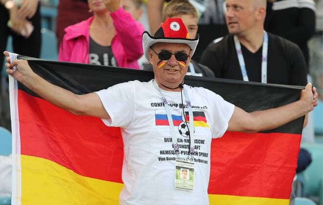 SOCHI, RUSSIA - JUNE 25, 2017: A German fan cheering in the stands at his teamâ€™s 2017 FIFA Confederations Cup Group B football match against Cameroon at Fisht Olympic Stadium. Artyom Korotayev TASS  TS054BF9