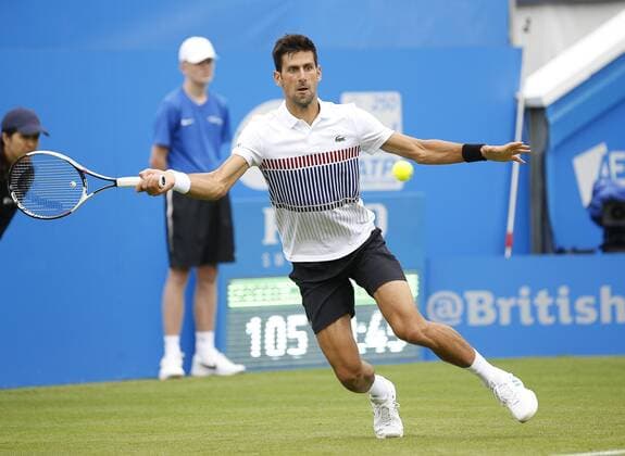 June 28th 2017, Devonshire Park, Eastbourne, England; Aegon International Eastbourne; Novak Djokovic (SRB) versus Vasek Pospisil (CAN); Djokovic hits a forehand as he won his 2nd round match 6-4 6-3 xHongboxChenx  ActionPlus11894966
