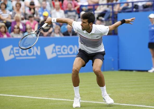June 28th 2017, Devonshire Park, Eastbourne, England; Aegon International Eastbourne; ; Novak Djokovic (SRB) versus Vasek Pospisil (CAN); Djokovic hits a backhand as he wins his 2nd round match 6-4 6-3 xHongboxChenx  ActionPlus11894955