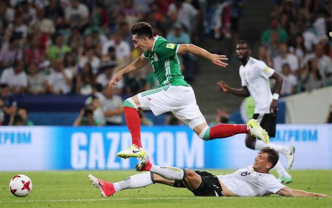 SOCHI, RUSSIA - JUNE 29, 2017: Mexico s Hector Herrera (L) and Germany s Leon Goretzka fight for the ball in their 2017 FIFA Confederations Cup semifinal football match at Fisht Stadium. Artyom Korotayev TASS  TS0557CA