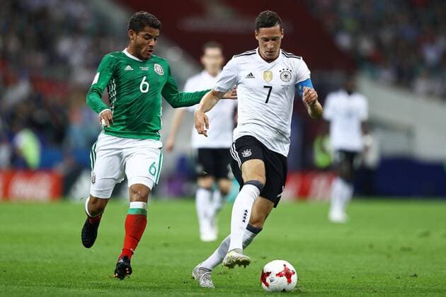 Germany vs Mexico SOCHI, SC - 29.06.2017: GERMANY VS MEXICO - Julian Draxler of Germany is bidding with Mexico& 39;s Jonathan Dos Santos during a match between Germany and Mexico in the semifinals of the 2017 FIFA Confederns Cup on Thn Thursday at the Sochi Olympic Stadium in Sochi, Russia. (Photo: Heuler Andrey DiaEsportivo Fotoarena) x1347266x  HeulerxAndrey