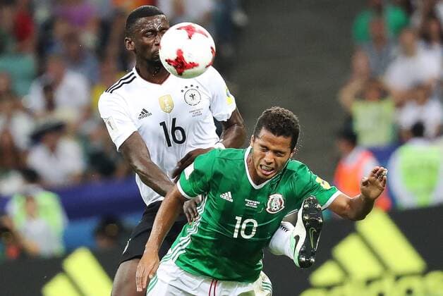 SOCHI, RUSSIA - JUNE 29, 2017: Germany s Antonio Ruediger (L) and Mexico s Giovani dos Santos fight for the ball in their 2017 FIFA Confederations Cup semifinal football match at Fisht Stadium. Artyom Korotayev TASS  TS0557D3