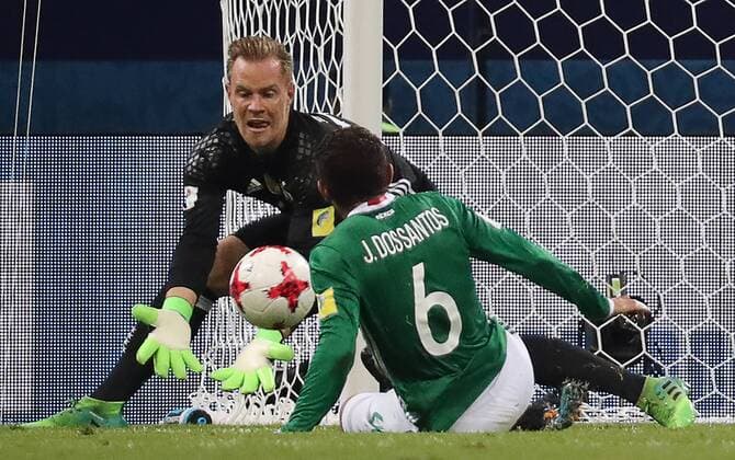SOCHI, RUSSIA - JUNE 29, 2017: Germany s goalkeeper Marc-Andre ter Stegen (L) and Mexico s Jonathan dos Santos in action in their 2017 FIFA Confederations Cup semifinal football match at Fisht Stadium. Artyom Korotayev TASS  TS0557FA