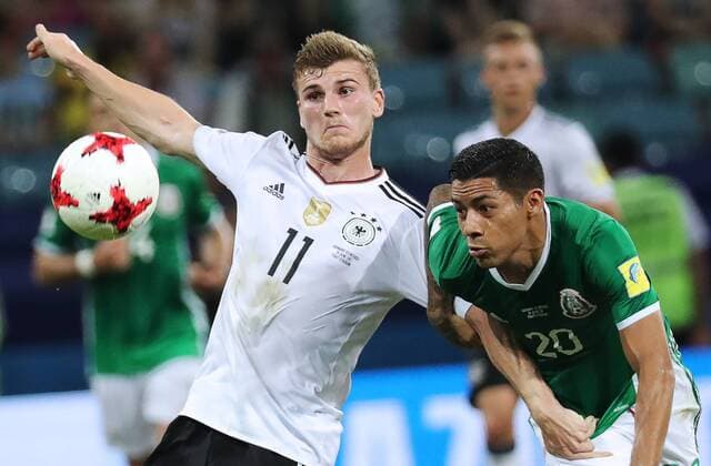 SOCHI, RUSSIA - JUNE 29, 2017: Germany s Timo Werner (L) and Mexico s Javier Aquino fight for the ball in their 2017 FIFA Confederations Cup semifinal football match at Fisht Stadium. Artyom Korotayev TASS  TS055812