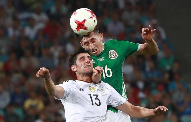 SOCHI, RUSSIA - JUNE 29, 2017: Germany s Lars Stindl (L) and Mexico s Hector Herrera jump to head the ball in their 2017 FIFA Confederations Cup semifinal football match at Fisht Stadium. Sergei Fadeichev TASS  TS055818