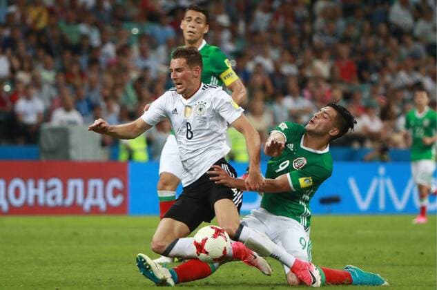SOCHI, RUSSIA - JUNE 29, 2017: Germany s Leon Goretzka (L) and Mexico s Raul Jimenez fight for the ball in their 2017 FIFA Confederations Cup semifinal football match at Fisht Stadium. Germany won the game 4-1. Sergei Fadeichev TASS  TS05583F