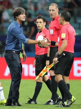 SOCHI, RUSSIA - JUNE 29, 2017: Germany s head coach Joachim Low (L) shakes hands with referees after the 2017 FIFA Confederations Cup semifinal football match against Mexico at Fisht Stadium. Germany won the game 4-1. Artyom Korotayev TASS  TS055853