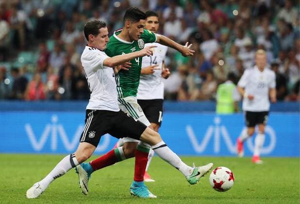 SOCHI, RUSSIA - JUNE 29, 2017: Germany s Sebastian Rudy (L) and Mexico s Raul Jimenez fight for the ball in their 2017 FIFA Confederations Cup semifinal football match at Fisht Stadium. Germany won the game 4-1. Artyom Korotayev TASS  TS055857