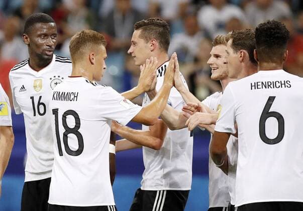 Soccer: Germany set up Confederations Cup final with Chile Timo Werner (3rd from R) of Germany celebrates with teammate Joshua Kimmich (18) after scoring the team s third goal during the second half of a Confederations Cup semifinal against Mexico in Sochi, Russia, on June 29, 2017. Germany won 4-1 and will face Chile in the July 2 final. 