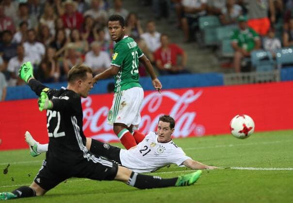 (170630) -- SOCHI, June 30, 2017 -- Marc-Andre Ter Stegen (L), goalkeeper of Germany, blocks the ball shot by Giovani Dos Santos (back) of Mexico during the semifinal match of the 2017 FIFA Confederations Cup in Sochi, Russia, June 29, 2017. Germany won 4-1. ) (SP)RUSSIA-SOCHI-2017 FIFA CONFEDERATIONS CUP-SEMIFINAL-GER VS MEX XuxZijian 