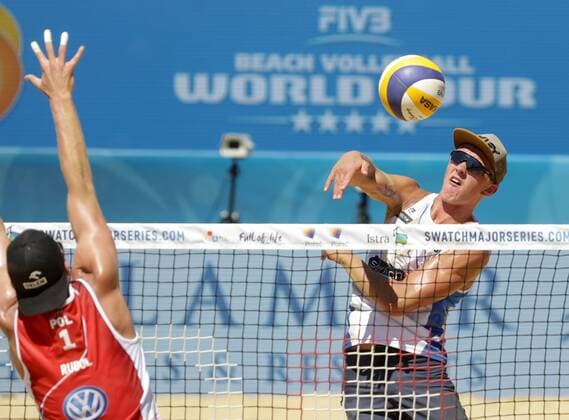 (170702) -- POREC, July 2, 2017 -- Artem Yarzutkin (R) of Russia spikes the ball during the men s round 3 match of FIVB Swatch Beach volleyball Beachvolleyball Major Series between Russia s Oleg Stoyanovskiy and Artem Yarzutkin and Poland s Maciej Rudol and Jakub Szalankiewicz in Porec, Croatia, on July 1, 2017. Russia s Oleg Stoyanovskiy and Artem Yarzutkin won 2-1. )(wll) (SP)CROATIA-POREC-BEACH VOLLEYBALL-FIVB-MAJOR SERIES LukaxStanzl 