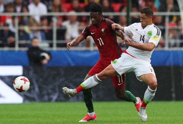 MOSCOW, RUSSIA â€“ JULY 2, 2017: Portugalâ€™s Nelson Semedo (L) and Mexicoâ€™s Javier Hernandez struggle for the ball in their 2017 FIFA Confederations Cup third place football match at Otkrytie Arena. Sergei Savostyanov TASS  TS055C5A