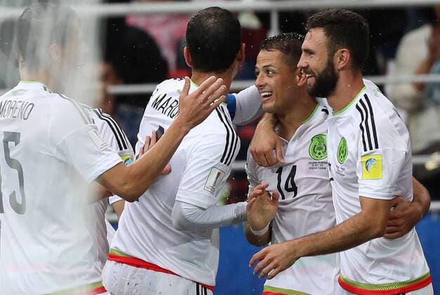 MOSCOW, RUSSIA â€“ JULY 2, 2017: Mexicoâ€™s Miguel Layun, Javier Hernandez (R-L) and their teammates celebrate scoring against Portugal in their 2017 FIFA Confederations Cup third place football match at Otkrytie Arena. Sergei Savostyanov TASS  TS055C6D