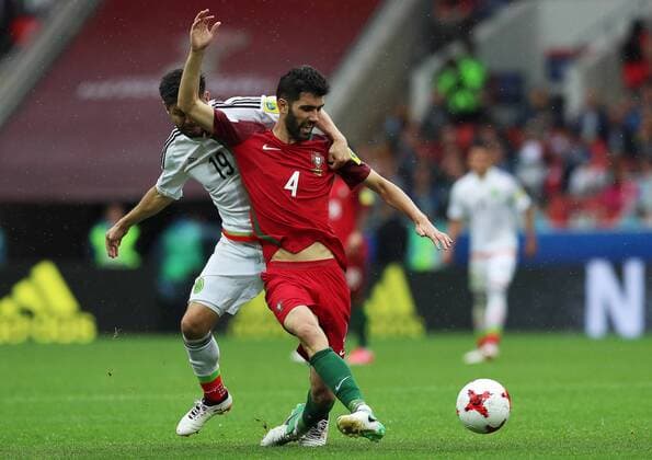 MOSCOW, RUSSIA â€“ JULY 2, 2017: Portugalâ€™s Luis Neto (front) and Mexicoâ€™s Oribe Peralta struggle for the ball in their 2017 FIFA Confederations Cup third place football match at Otkrytie Arena. Sergei Savostyanov TASS  TS055C6F