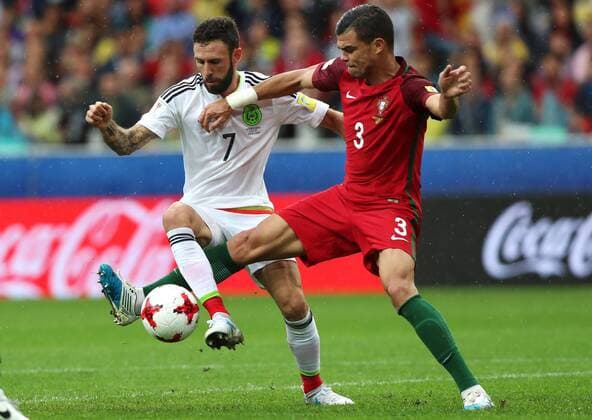 MOSCOW, RUSSIA â€“ JULY 2, 2017: Mexicoâ€™s Miguel Layun (L) and Portugalâ€™s Pepe struggle for the ball in their 2017 FIFA Confederations Cup third place football match at Otkrytie Arena. Sergei Savostyanov TASS  TS055C78