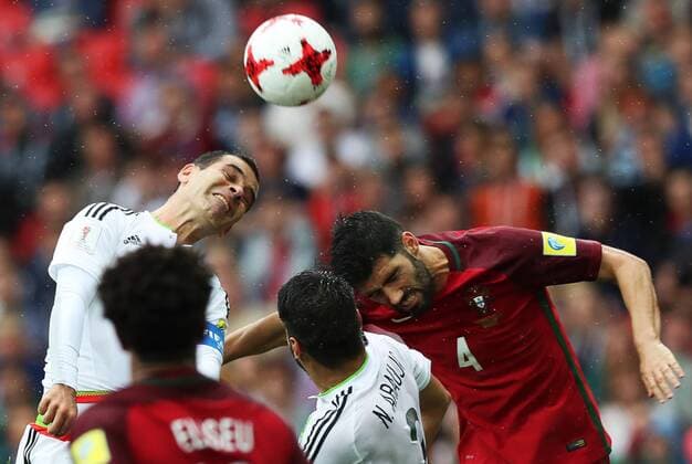 MOSCOW, RUSSIA â€“ JULY 2, 2017: Mexicoâ€™s Rafael Marquez and Portugalâ€™s Luis Neto (L-R back) struggle for the ball in their 2017 FIFA Confederations Cup third place football match at Otkrytie Arena. Sergei Savostyanov TASS  TS055C88