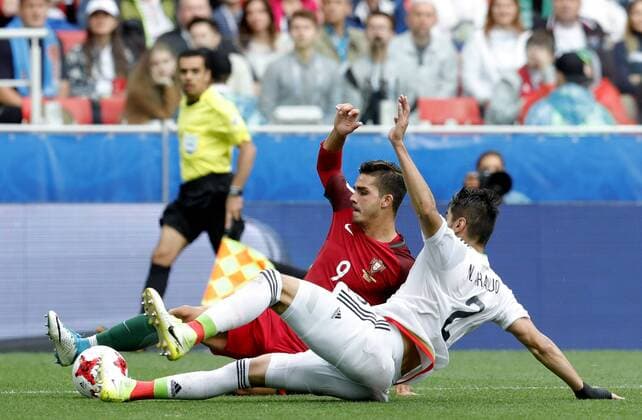 MOSCOW, RUSSIA â€“ JULY 2, 2017: Portugal s Andre Silva (L) and Mexico s Nestor Araujo fight for the ball in their 2017 FIFA Confederations Cup third place football match at Spartak Stadium. Portugal won the game 2-1 in extra time and claimed bronze medals. Mikhail Japaridze TASS  TS055CA9