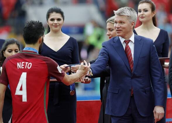 MOSCOW, RUSSIA â€“ JULY 2, 2017: Portugal s Luis Neto (L) shakes hands with Russia s Minister Pavel Kolobkov (R) at an awards ceremony after winning their 2017 FIFA Confederations Cup third place football match against Mexico at Spartak Stadium. Portugal won the game 2-1 in extra time and claimed bronze medals. Mikhail Japaridze TASS  TS055CC4