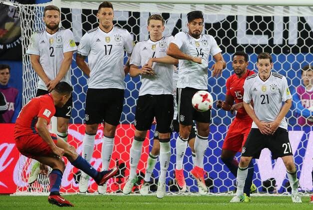 ST PETERSBURG, RUSSIA â€“ JULY 2, 2017: Chile s Alexis Sanchez performs a free kick over Germany s Shkodran Mustafi, Niklas Suele, Matthias Ginter, Emre Can, Sebastian Rudy (L-R) in their 2017 FIFA Confederations Cup final football match at St Petersburg Arena Stadium. Germany won the game 1-0 and claimed their first Confederations Cup title. Alexander Demianchuk TASS  TS055DCE