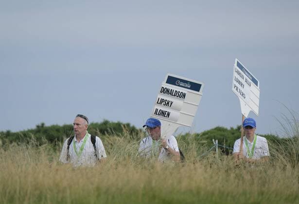 July 6th 2017, Portstewart Golf Club, Portstewart, Northern Ireland; Dubai Duty Free Irish Open Golf Championship; Day 1; Markers carry the player names head towards the opening tee at the start of the round xNigelxCookex  ActionPlus11898236