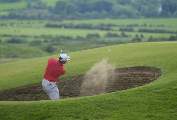 July 6th 2017, Portstewart Golf Club, Portstewart, Northern Ireland; Dubai Duty Free Irish Open Golf Championship; Day1; Hideki Matsuyama (JPN) plays his approach shot onto the 6th green from a bunker xNigelxCookex  ActionPlus11898292