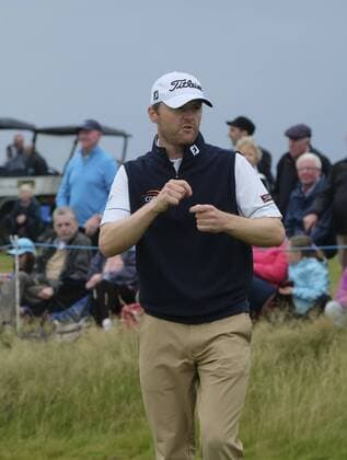 July 6th 2017, Portstewart Golf Club, Portstewart, Northern Ireland; Dubai Duty Free Irish Open Golf Championship; Day1; Michael Hoey (ENG) offers to sign the ball he just threw to a young fan after making a birdie putt xNigelxCookex  ActionPlus11898433