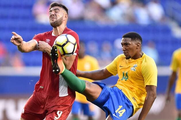 July 7, 2017 - Harrison, New Jersey, U.S - French Guiana midfielder GREGORY LESCOT (14) clears the ball away from Canada midfielder LUCAS CAVALLINI (9) during CONCACAF Gold Cup 2017 at Red Bull Arena in Harrison New Jersey Canada defeats French Guiana 4 to 2. Soccer 2017 - Canada defeats French Guiana - ZUMAa301 20170707_zaf_a301_002 Copyright: xBrooksxVonxArxx
