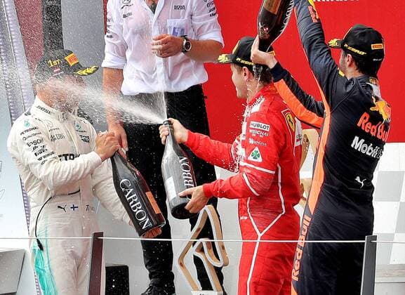 FORMULA 1 - GP of Austria 2017 SPIELBERG,AUSTRIA,09.JUL.17 - MOTORSPORTS, FORMULA 1 - Grand Prix of Austria, Red Bull Ring, award ceremony. Image shows Valtteri Bottas (FIN Mercedes), Sebastian Vettel (GER Ferrari) and Daniel Ricciardo (AUS Red Bull Racing). GEPAxpictures xHansxOberlaender