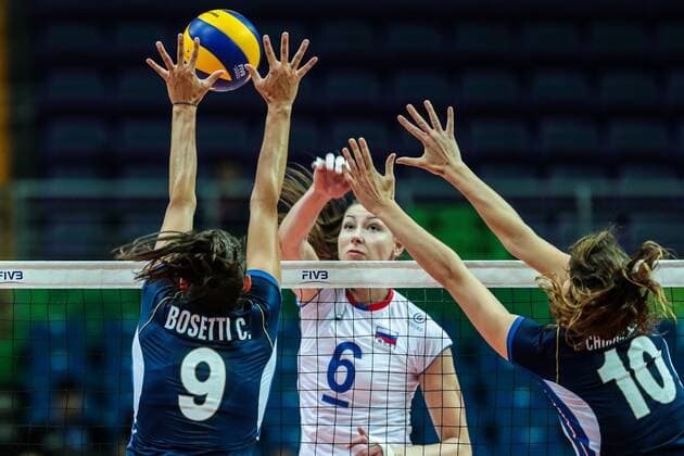 Caterina Bosetti, and Cristina Chirichella, front, of Italy, try to block a spike by Irina Zaryazhko of Russia during the Pool B1-Group 1 match of the FIVB World Grand Prix 2017 in Kunshan city, east China s Jiangsu province, 9 July 2017. Italy defeated Russia 3-2. Italy beats Russia 3-2 at 2017 FIVB World Grand Prix in east China  20170709_05866